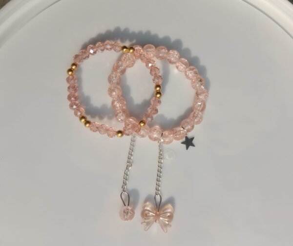 crack and crystal beaded bracelet with bow charm